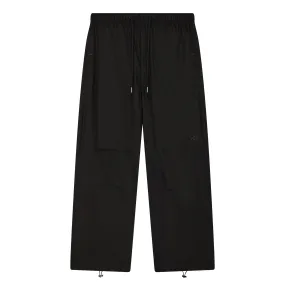 Le pantalon parachute noir