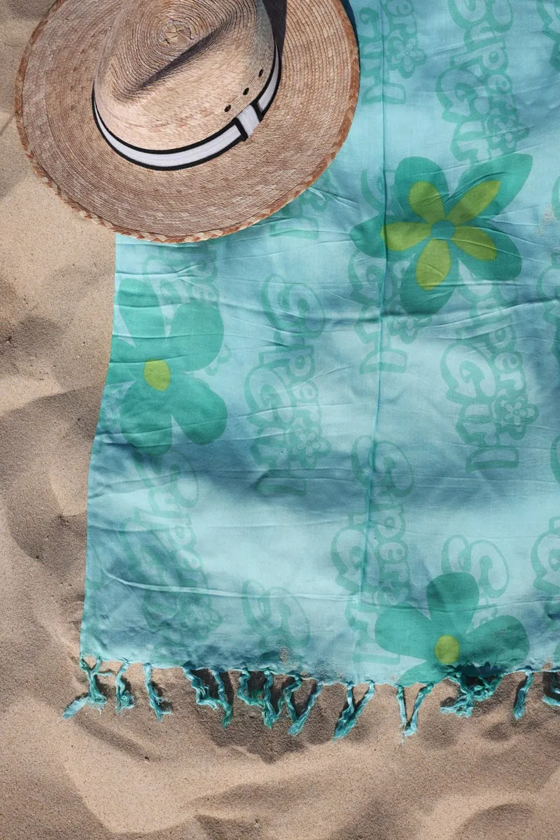 Paréo de plage grande taille turquoise avec franges motif Flower girl